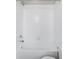 Shower featuring white tiles, modern shower head, a built in bench and clear glass doors at 9490 W 14Th Ave # 3, Lakewood, CO 80215