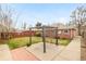 Large backyard with a concrete patio, mature trees, lawn and perimeter fence at 2972 Kearney St, Denver, CO 80207