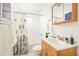 Cozy bathroom with shower and bathtub combination and vanity at 2972 Kearney St, Denver, CO 80207