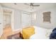 Clean bedroom with a double closet, overhead fan and hallway access at 2972 Kearney St, Denver, CO 80207