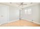 Bright bedroom features wood floors, ceiling fan, and double-hung windows allowing ample natural light at 2972 Kearney St, Denver, CO 80207