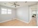 Bright bedroom features wood floors, ceiling fan, and double-hung windows allowing ample natural light at 2972 Kearney St, Denver, CO 80207
