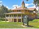 Exterior view of a historic brick building with a turret and covered porch at 2972 Kearney St, Denver, CO 80207