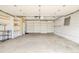 Spacious two-car garage with concrete floors, built-in shelving, and ample storage space at 2972 Kearney St, Denver, CO 80207