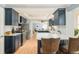 Modern kitchen with marble countertops, stainless steel appliances, and stylish bar stool seating at 2972 Kearney St, Denver, CO 80207