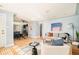 Open-concept living space with hardwood floors, comfortable sofa, and easy access to the kitchen at 2972 Kearney St, Denver, CO 80207
