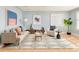 Bright living room with hardwood floors, comfortable seating, and stylish decor at 2972 Kearney St, Denver, CO 80207