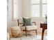 Sitting area bathed in light from the window with white shutters and a patterned rug at 2972 Kearney St, Denver, CO 80207