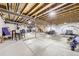 Large unfinished basement with exposed ceiling and ample open space at 15211 Quince St, Thornton, CO 80602