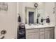 Bright bathroom with double sinks and stylish fixtures and large mirror at 15211 Quince St, Thornton, CO 80602