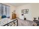 Cozy bedroom features soft carpet, natural light, and neutral décor at 15211 Quince St, Thornton, CO 80602