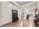 Inviting foyer features wood floors, ample closet space, and seamless flow to other living areas at 15211 Quince St, Thornton, CO 80602