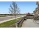 House with a stone facade, a tree, and a spacious front yard in a suburban neighborhood at 15211 Quince St, Thornton, CO 80602