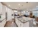 Kitchen features granite countertops, stainless steel appliances, and an open layout at 15211 Quince St, Thornton, CO 80602