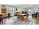 Open concept layout with a dining area, fireplace, and seamless connection to the living space at 15211 Quince St, Thornton, CO 80602