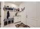 Convenient mudroom with built-in storage and seating area at 15211 Quince St, Thornton, CO 80602