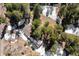 Aerial view of a home surrounded by trees shows the roof's layout and how it integrates with the natural surroundings at 2859 Cagle Dr, Larkspur, CO 80118