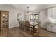 Charming dining room with wood floors and a view to the back deck at 2859 Cagle Dr, Larkspur, CO 80118