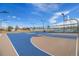 Well-maintained basketball court with vibrant blue and tan surfaces, perfect for sports and recreation at 10792 E Exposition Ave # 154, Aurora, CO 80012