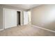 Bedroom features sliding door closet, neutral walls, and carpeted floor at 10792 E Exposition Ave # 154, Aurora, CO 80012