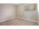 Bedroom with carpeted floor, neutral paint, and window for natural light at 10792 E Exposition Ave # 154, Aurora, CO 80012