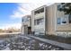 Exterior view of multi-unit building showcasing light colored siding and outdoor space at 10792 E Exposition Ave # 154, Aurora, CO 80012