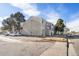 Multi-unit exterior with parking, signage and trees with unit number visible at 10792 E Exposition Ave # 154, Aurora, CO 80012