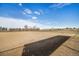 Expansive, sun-drenched open field with a clear blue sky is ideal for various recreational activities at 10792 E Exposition Ave # 154, Aurora, CO 80012