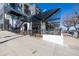 Commercial building exterior with an outdoor patio area surrounded by black metal fencing at 2501 15Th St # 2C, Denver, CO 80211