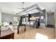 Contemporary kitchen features a breakfast bar, modern appliances, and opens to the dining area at 2501 15Th St # 2C, Denver, CO 80211