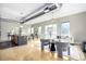 Stylish living area with open layout, hardwood floors, and modern furniture, open to kitchen at 2501 15Th St # 2C, Denver, CO 80211