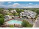 Community aerial showcasing the pool, clubhouse, and surrounding residences at 1820 Newland Ct # 310, Lakewood, CO 80214