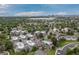 Areal view of the community featuring lush greenery, a pool, and city backdrop at 1820 Newland Ct # 310, Lakewood, CO 80214