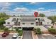 Attractive condo building with ample covered parking and inviting stairwell entries at 1820 Newland Ct # 310, Lakewood, CO 80214