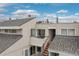 This inviting townhome features a private balcony and well-maintained exterior at 1820 Newland Ct # 310, Lakewood, CO 80214
