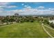 Expansive green park with walking paths and mature trees offers a serene outdoor space at 1820 Newland Ct # 310, Lakewood, CO 80214