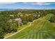 Stunning aerial view of an estate home nestled in a golf course community with mountain views at 77 Comstock Pl, Castle Rock, CO 80108