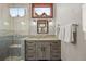 Bathroom featuring custom vanity, tiled shower with seating, and modern fixtures at 77 Comstock Pl, Castle Rock, CO 80108