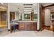 Well-appointed bathroom featuring a vanity with ample storage, makeup area, and a walk-in shower at 77 Comstock Pl, Castle Rock, CO 80108