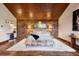 Luxurious bedroom with a wood-paneled ceiling, accent wall, and stylish decor for a comfortable retreat at 77 Comstock Pl, Castle Rock, CO 80108