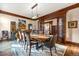 Refined dining room with a long wooden table, statement chairs, and ornate wood trim accents at 77 Comstock Pl, Castle Rock, CO 80108