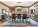 Elegant dining room with wooden table, decorative rug, and refined wood trim at 77 Comstock Pl, Castle Rock, CO 80108