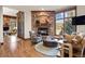 Cozy living room with brick fireplace, comfortable seating, and natural light at 77 Comstock Pl, Castle Rock, CO 80108