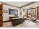 Bright office space with wood trim windows, contemporary desk, and comfortable chairs at 77 Comstock Pl, Castle Rock, CO 80108