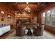 Luxurious wood paneled office with custom built-ins, coffered ceilings and a large desk at 77 Comstock Pl, Castle Rock, CO 80108