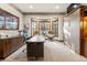 Spacious home office with custom wood trim, built-in storage, and a bay window with stunning views at 77 Comstock Pl, Castle Rock, CO 80108