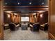 Home theater room with plush seating, ambient lighting, and a large projection screen at 77 Comstock Pl, Castle Rock, CO 80108