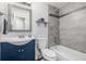 Bathroom with tiled shower-tub, modern vanity, and decorative mirror at 3134 S Fairplay St, Aurora, CO 80014