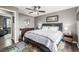 Comfortable bedroom featuring a ceiling fan, modern decor, and a queen-sized bed at 3134 S Fairplay St, Aurora, CO 80014