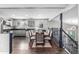 Dining room with hardwood floors between an open kitchen and next to stairwell at 3134 S Fairplay St, Aurora, CO 80014